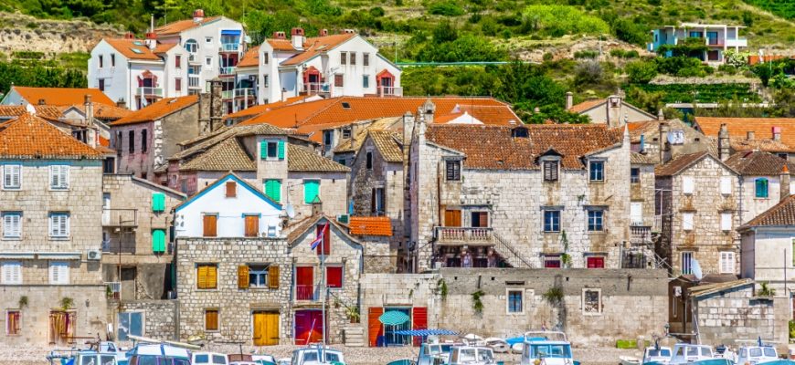 Waterfront scenic view at old fisherman place Komiza on Island Vis, Croatia